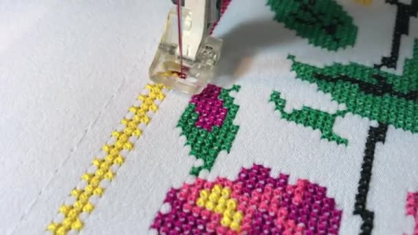Embroidery machine embroidery floral pattern cross on white fabric - Footage, Video