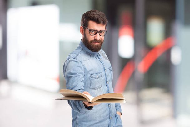 happy young man with small book - Foto, Imagem