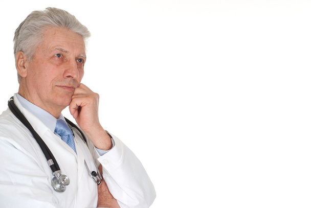 Beauteous elderly doctor in a white coat - Foto, imagen