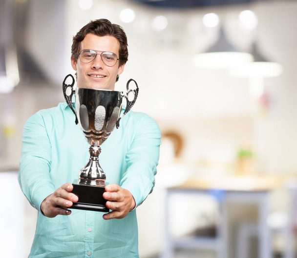 happy young man with sport cup - Photo, Image