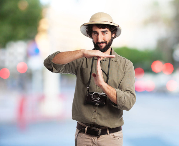 proud explorer man with time out sign - 写真・画像