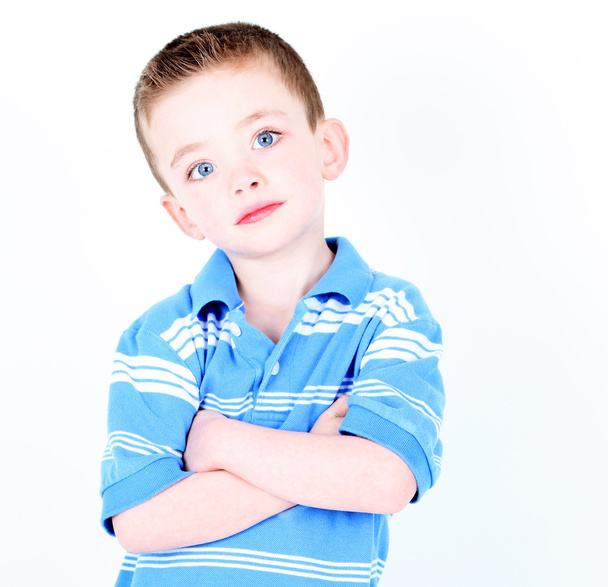Young boy with arms crossed isolated on white - Foto, Imagen