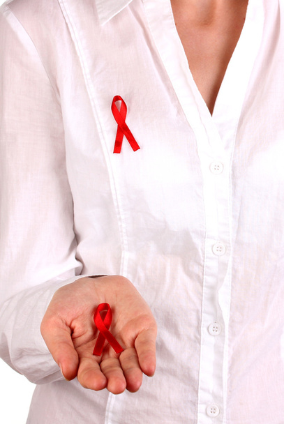 Woman with red ribbon in hands on isolated on white - Photo, Image