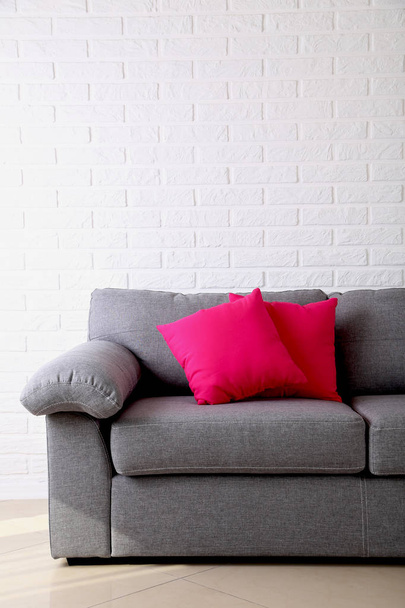 Colorful pillows on grey sofa  - Foto, afbeelding