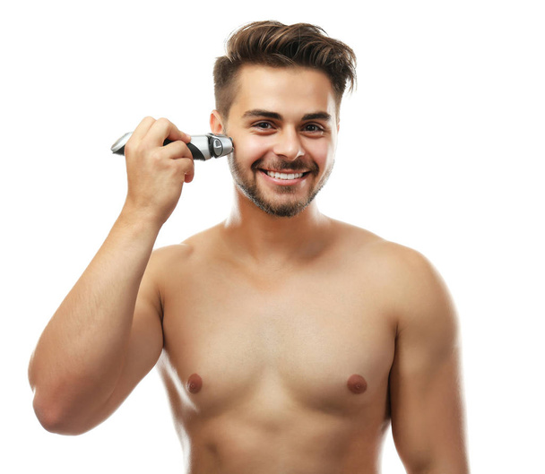 Handsome man shaving isolated on white - Foto, Imagen