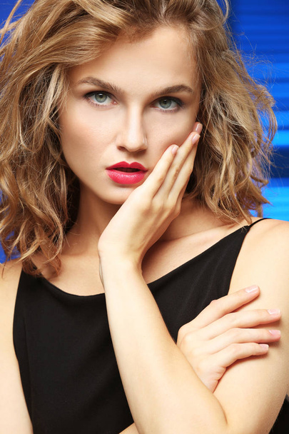Closeup portrait of beautiful young woman on colour background - Foto, imagen