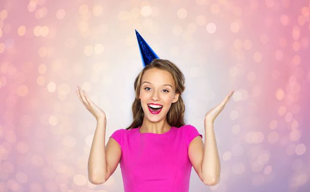 happy young woman or teen girl in party cap - Fotografie, Obrázek