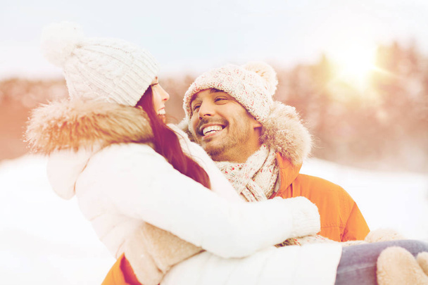 happy couple outdoors in winter - Фото, изображение