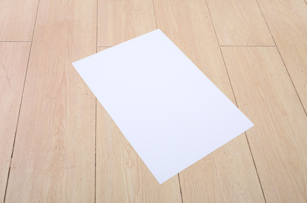 A4 paper on floor - Фото, зображення