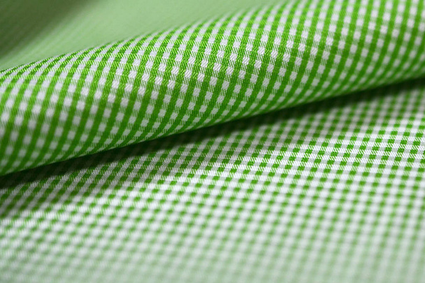 közelről roll zöld és fehér scott-mintát szövet ing - Fotó, kép