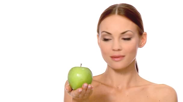 Portrait of beautiful and sexy woman, holding apple - Imágenes, Vídeo