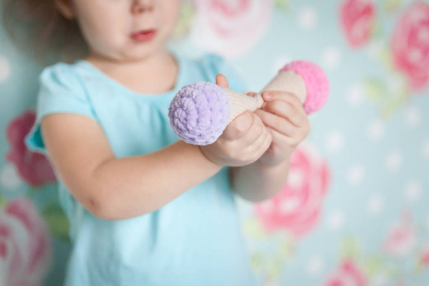 Little girl hands with a knitted toys - Photo, Image