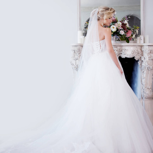 Charming young bride in luxurious wedding dress. Pretty girl, photo Studio - Fotó, kép