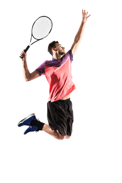 Young man is playing tennis  - Valokuva, kuva