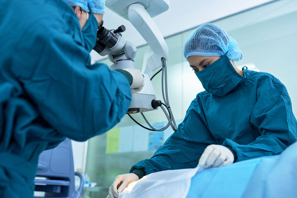 surgeons working on patient - Photo, Image