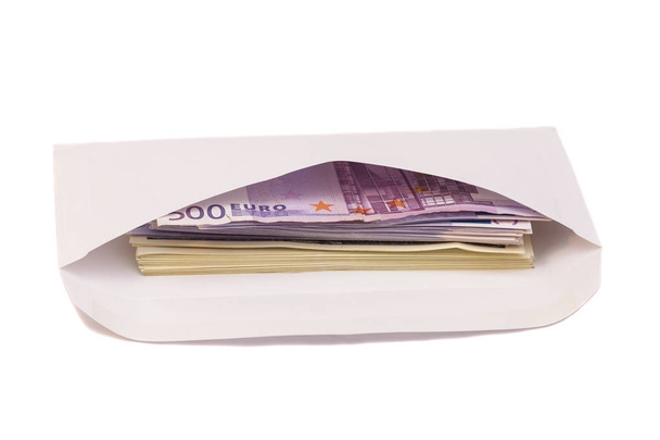 Stack of euro and dollars in open envelope isolated on white - Foto, Imagem