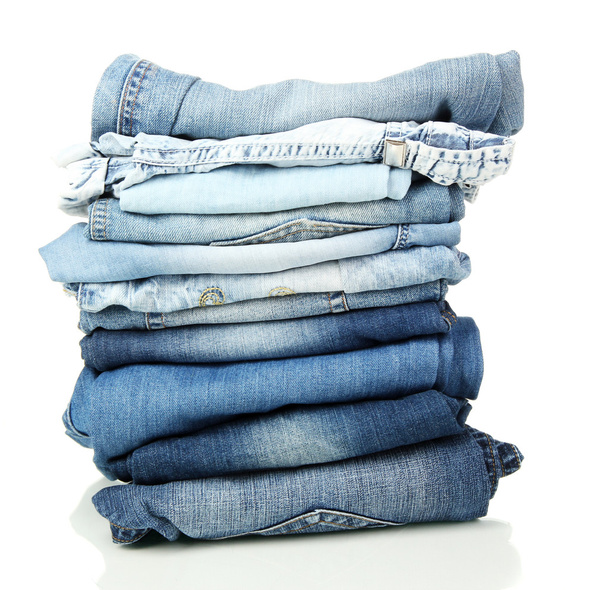 Lot of different blue jeans isolated on white - Foto, Imagen