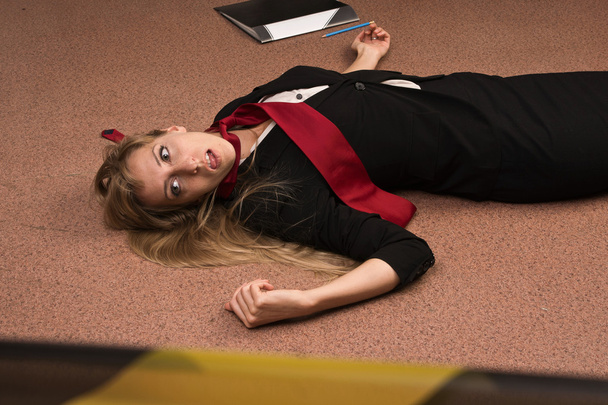 Lifeless business woman lying on the floor (imitation) - Фото, зображення