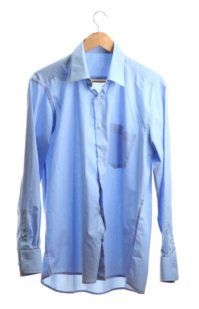 blue shirt on wooden hanger isolated on white - Fotó, kép