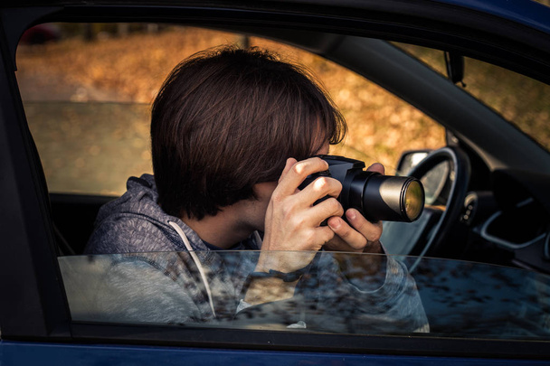 photographer with digital camera take photo from car - Photo, Image