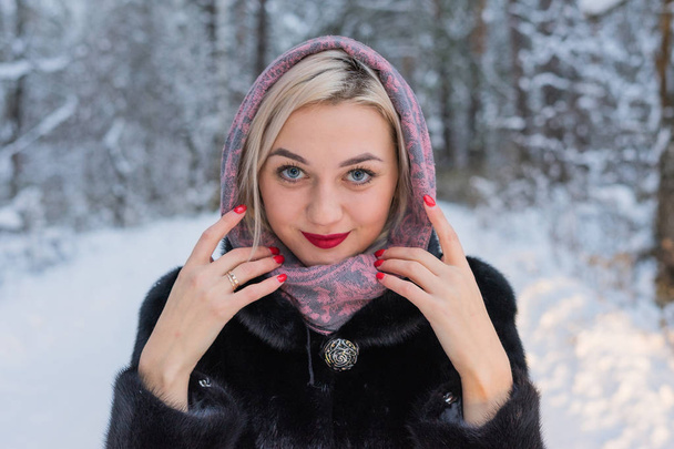Portrait of a girl in a winter forest - Фото, изображение