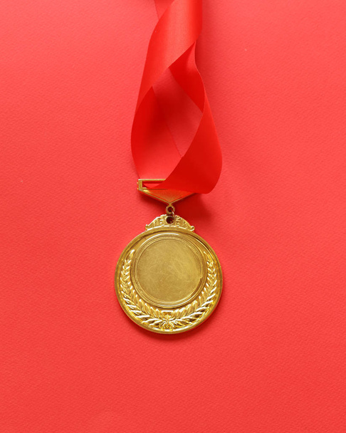 Gold medal with ribbon. The victory and the first place. - Zdjęcie, obraz