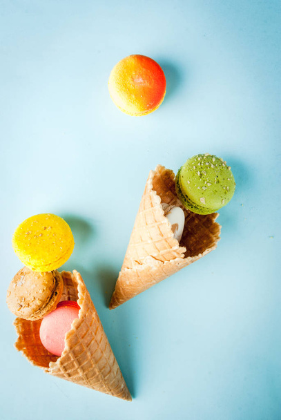 Multicolored macaroon cookies with ice cream cones - Foto, imagen
