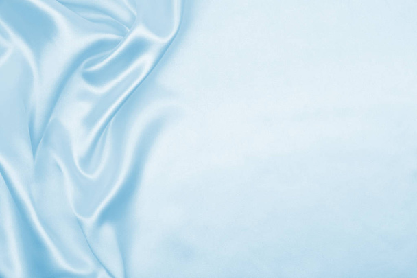 Hladká elegantní modrá hedvábí nebo satén luxusní tkaniny textury jako abstra - Fotografie, Obrázek