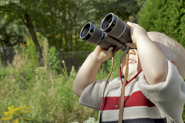 Boy with Binoculars in the Garden - Photo, image