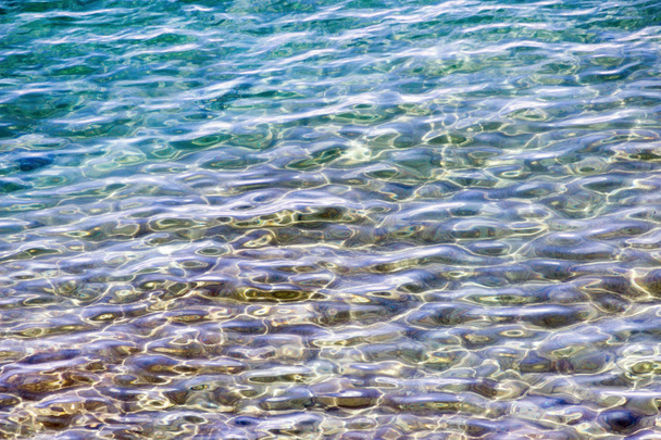 Superficie de agua de mar clara
 - Foto, Imagen