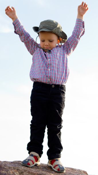 Little boy balanced on a rock - Photo, image