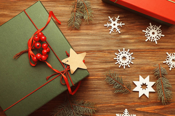 Christmas concept. Gift boxes and decorations on wooden background - Foto, Imagem