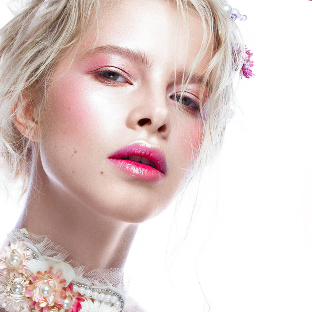 Beautiful blond fashion girl with flowers on neck and in her hair, wet Nude makeup. Beauty face. - Φωτογραφία, εικόνα