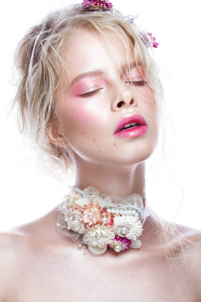 Beautiful blond fashion girl with flowers on neck and in her hair, wet Nude makeup. Beauty face. - Foto, imagen