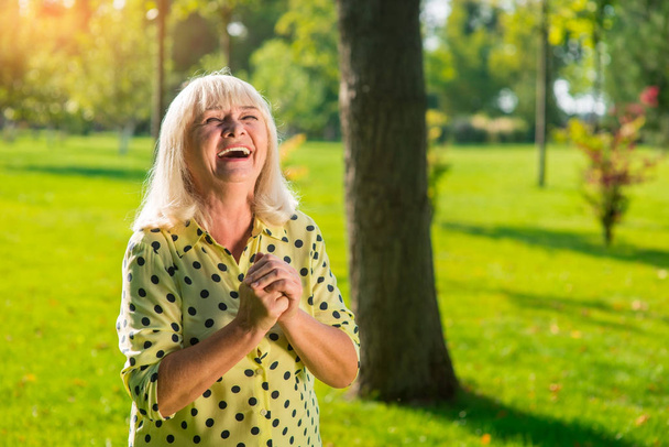 Elderly woman laughing. - Фото, зображення