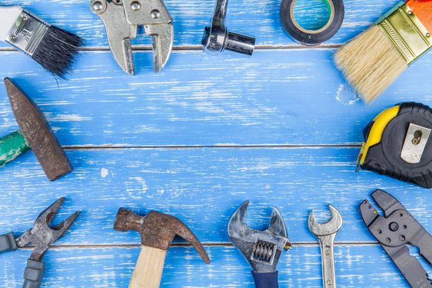 Construction tools on blue wooden table background copy space.ma - Photo, Image