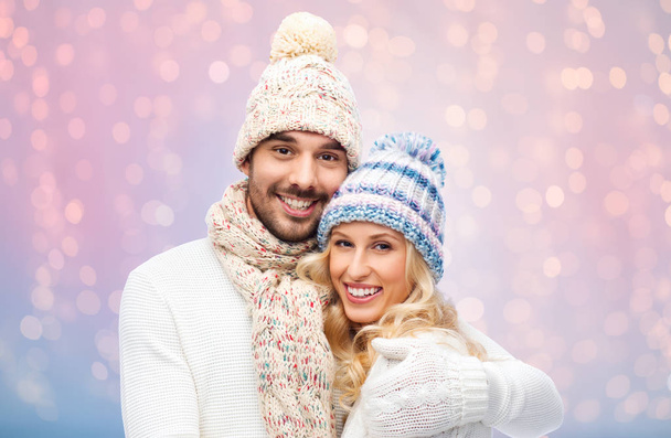 smiling couple in winter clothes hugging - Foto, Imagem