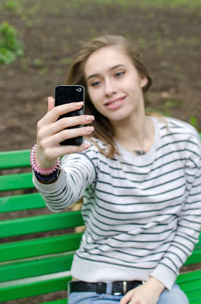 Young girl making selfie - 写真・画像