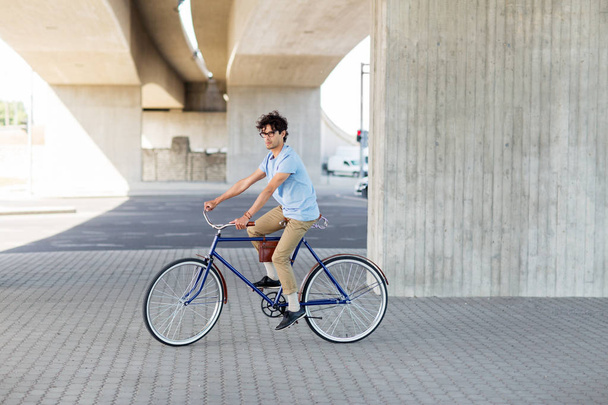 young hipster man riding fixed gear bike - Fotoğraf, Görsel