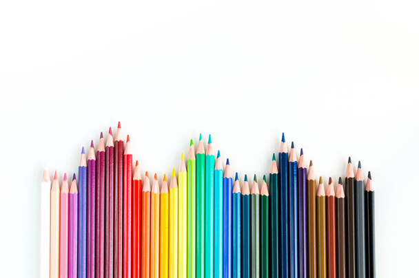 Crayons and watercolor pastels lined up isolated on white - Fotografie, Obrázek