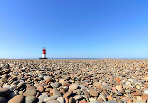 Lighthouse with Beach Pebbles in foreground - Photo, Image