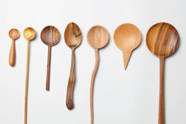 Assorted different kitchen wooden utensils cutlery - Foto, Imagen