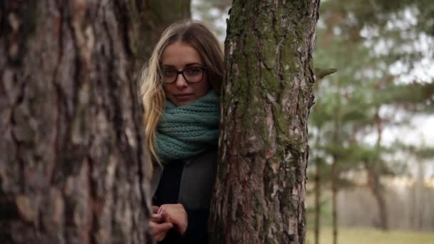 girl sits in a pine in a protective suit autumn - Footage, Video