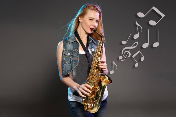 beautiful blonde as saxophonist woman - Fotó, kép