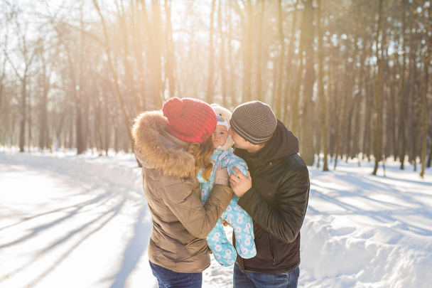 happy young family spending time outdoor in winter - 写真・画像
