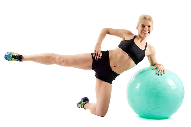 Fitness girl workout with gym ball - Foto, afbeelding