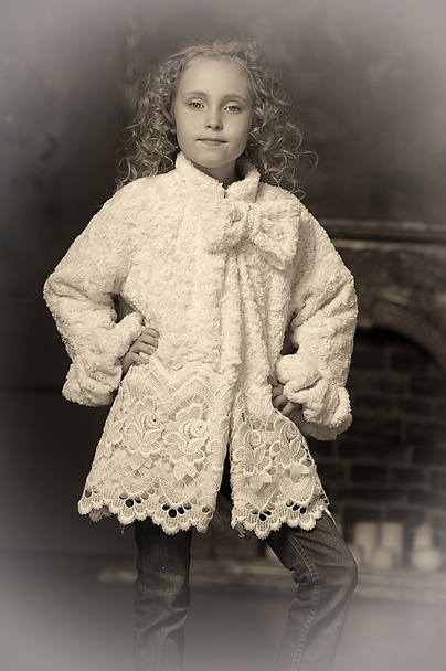 Girl in a stylish coat of artificial fur - Фото, зображення