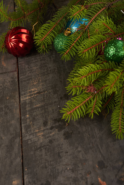 Christmas tree and decorations on wooden background - Фото, изображение