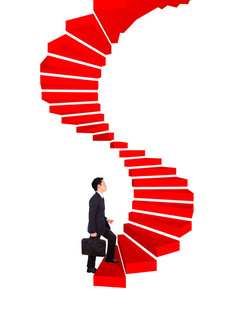 бизнесмен поднимается наверх по изогнутой лестнице к успеху
 - Фото, изображение