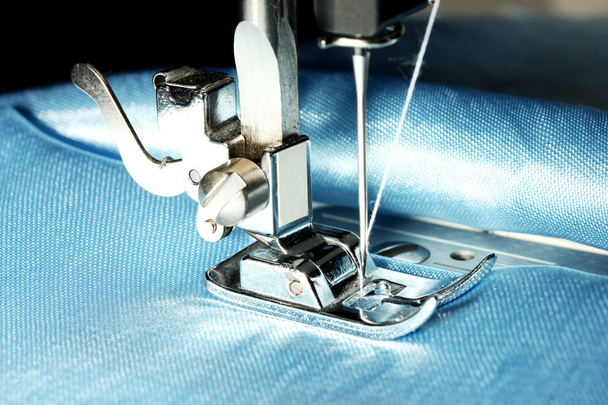 Sewing machine with blue cloth closeup - Foto, Imagen